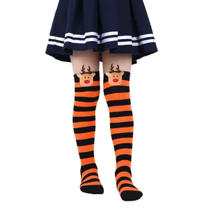 Detail of children's Christmas long socks featuring cute 3D reindeer plush doll accents