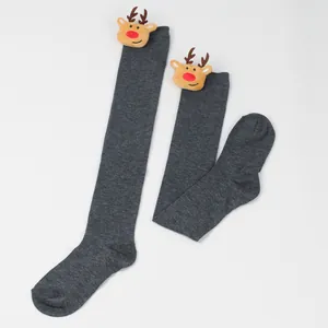Long grey over-the-knee Christmas socks featuring cute 3D plush reindeer head detail