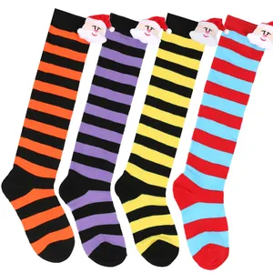 Vibrant striped children's Christmas long socks featuring cute 3D Santa Claus plush details