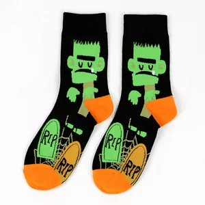 Close-up detail of Halloween men's cotton crew socks featuring Frankenstein and RIP designs