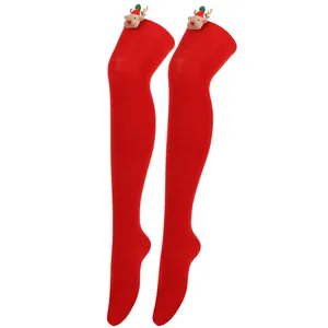 Detail view of red Christmas over-the-knee socks with 3D plush reindeer decorations.