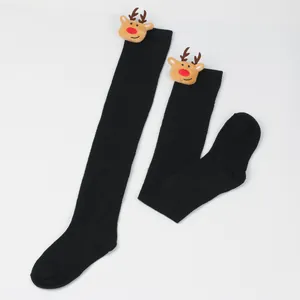 Black Christmas over-the-knee stockings with cute plush reindeer head decoration.