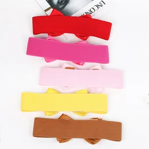 Detailed view of five colorful elastic waist belts with elegant bowknot designs for dresses
