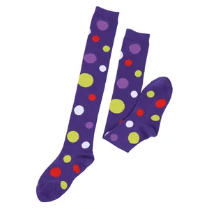 Detailed view of vibrant purple over-the-knee socks with multicolored polka dots
