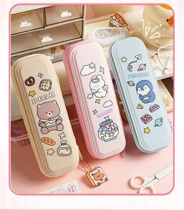Detailed view of three colorful cartoon EVA hardshell pencil cases featuring cute animal designs.