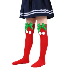 Red Christmas over-the-knee socks for girls featuring green bows and white pom-poms