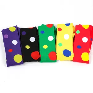 Close-up of five colorful polka dot over-the-knee socks for cosplay and festivals