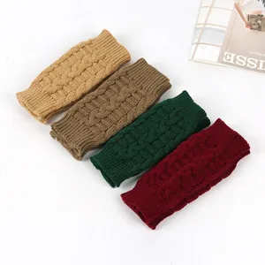 Detailed view of cable knit fingerless gloves in multiple colors for winter warmth