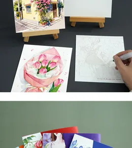 Detailed view of creative watercolor coloring book with floral and building sketches