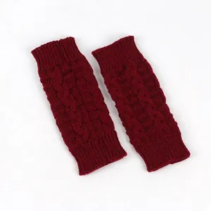 High-quality detail of burgundy cable knit fingerless gloves for winter warmth and comfort