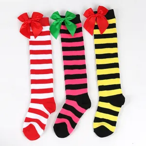 Three pairs of colorful striped knee-high socks for girls featuring large satin bows
