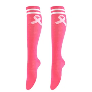 Pink knee-high socks featuring white stripes and a pink ribbon symbol for awareness.