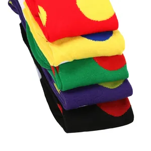 Macro view of colorful polka dot over-the-knee socks in a neat stacked presentation