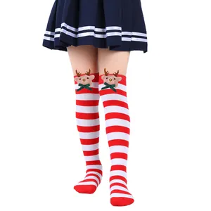 Close-up of children's Christmas over-the-knee socks with 3D reindeer doll and red stripes