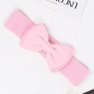 Detailed view of the pink chiffon bow-knot on a stretchy wide elastic waist belt.