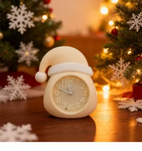 Detailed view of cream-colored Santa hat alarm clock in festive Christmas setting