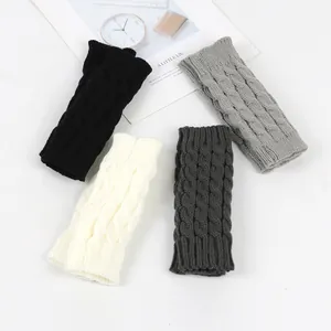Detail showing cable knit fingerless arm warmers in black, white, and gray colors