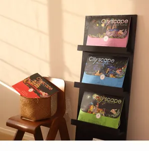 Collection of Cityscape scratch painting kits displayed on a black shelf and chair