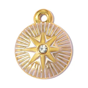 Macro view of a gold-plated stainless steel star pendant with a clear rhinestone