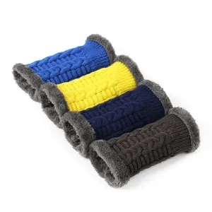 Detail of thick knitted arm warmers with grey faux fur lining in vibrant colors