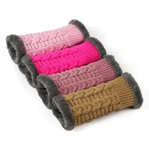 Detailed view of four colorful cable-knit warm wrist warmers with grey faux fur lining