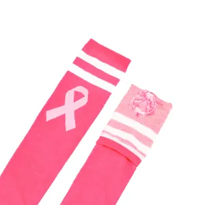 Detailed macro shot of pink breast cancer awareness knee-high socks with ribbon pattern