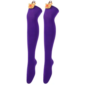 Detail of purple over-the-knee socks with festive plush reindeer ornaments at the top.