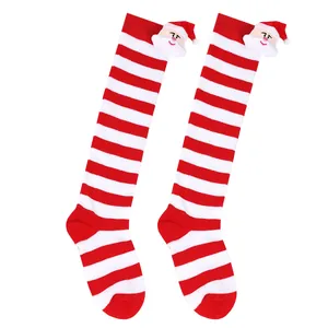 Knee-high red and white striped Christmas socks for kids with 3D plush Santa Claus decoration