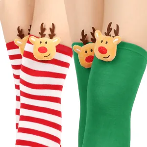 Christmas over-the-knee socks featuring festive plush reindeer heads and red-white stripes