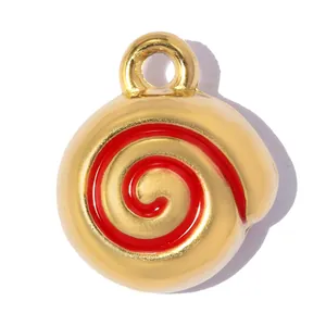 Close-up view of a golden stainless steel spiral pendant featuring vibrant red enamel inlay