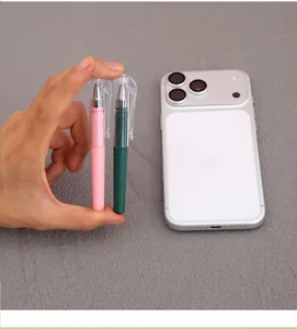 Mini portable pocket-sized gel pens compared to a smartphone for size reference.