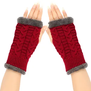 Detail of red cable-knit arm warmers featuring plush grey faux fur trim and lining