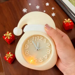 Creative Christmas Santa hat shaped alarm clock with night light feature for desk.
