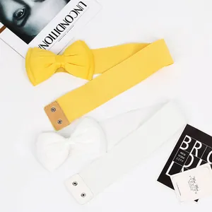 Detail view of elastic waist belts featuring elegant chiffon bowknots for dresses
