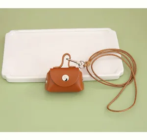 Mini brown PU leather neck-hanging pouch for earphone storage and coin purse details