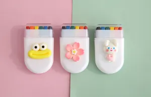 Detail view of 6-color rainbow face paint crayons featuring cute 3D cartoon charms.
