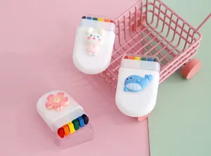Detailed macro view of 6-color rainbow face paint sticks featuring cute 3D cartoon characters