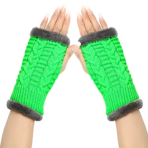 Macro view of neon green cable-knit fingerless gloves featuring grey faux fur trim