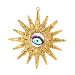 Detailed view of gold stainless steel sunburst pendant with center evil eye motif