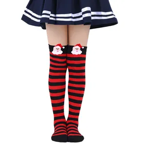 Detailed view of girls red and black striped Christmas socks with Santa Claus applique