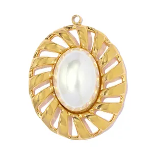 Macro view of gold-toned stainless steel pendant with white shell center piece