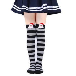 Detail view of striped over-the-knee socks with Santa Claus doll decoration