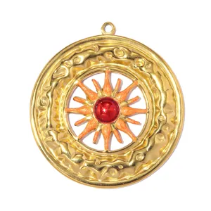 Detailed view of a gold stainless steel sun pendant with red center and orange rays.