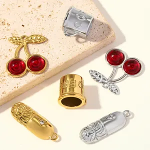 Close-up of 3D stainless steel coffee cup cherry and capsule charms for DIY jewelry