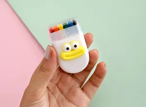 Close-up of portable 6-color rainbow face paint stick with cute cartoon design