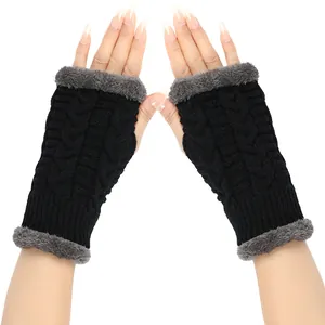Detail view of black cable-knit fingerless gloves with grey plush faux fur trim