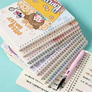 Detailed view of stacked cartoon A4 spiral sketchbooks with a pink pen on teal background