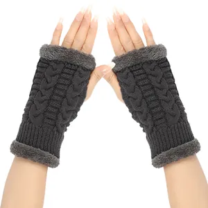 Close-up of dark grey cable knit fingerless gloves with soft faux fur trim detail