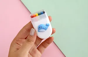 Compact 6-color rainbow face paint set with cute whale design for festive makeup.