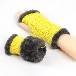 Macro detail view showing the thick grey plush lining of yellow knitted winter arm warmers.